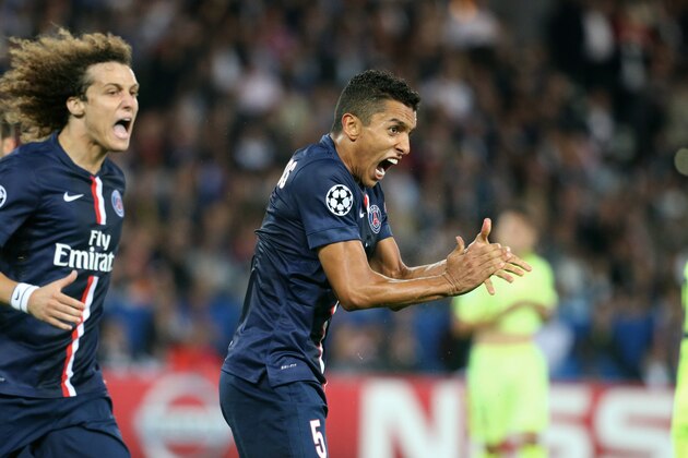 PARIS, FRANCE - SEPTEMBER 30:  David Luis and Marquinhos of Paris Saint-Germain celebrate the victory after the UEFA Champions League between Paris Saint-Germain FC and FC Barcelona at Parc Des Princes on September 30, 2014 in Paris, France.  (Photo by Xavier Laine/Getty Images)