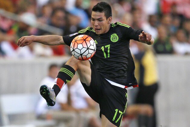 Mexico forward Hirving Lozano (17) controls the ball during the second half of a CONCACAF men's Olympic semifinal soccer match against Canada, Saturday, Oct. 10, 2015, in Sandy, Utah. (AP Photo/Rick Bowmer)
