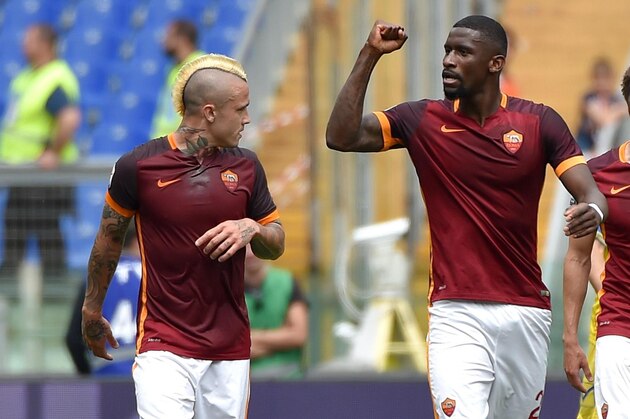 AS Roma's Antonio Rudiger, center, celebrates with his teammate Radja Nainggolan, left, after scoring a goal during the Italian Serie A soccer match between AS Roma and Chievo Verona at the Olympic stadium in Rome, Sunday, May 8, 2016.  (Ettore Ferrari/ANSA via AP Photo) ITALY OUT