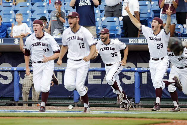 Texas A&M's players rush out of the dugout onto the field after they defeated Florida in the Southeastern Conference NCAA college baseball championship game at the Hoover Met, Sunday, May 29, 2016, in Hoover, Ala.(AP Photo/Brynn Anderson)
