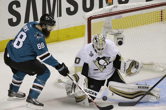 Pittsburgh Penguins goalie Matt Murray, right, defends a shot by San Jose Sharks defenseman Brent Burns (88) during the second period of Game 3 of the NHL hockey Stanley Cup Finals in San Jose, Calif., Saturday, June 4, 2016. (AP Photo/Eric Risberg)