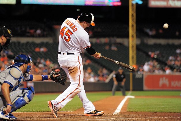 Jun 6, 2016; Baltimore, MD, USA; Baltimore Orioles designated hitter Mark Trumbo (45) hits a home run in the seventh inning against the Kansas City Royals at Oriole Park at Camden Yards. The Baltimore Orioles won 4-1. Mandatory Credit: Evan Habeeb-USA TODAY Sports