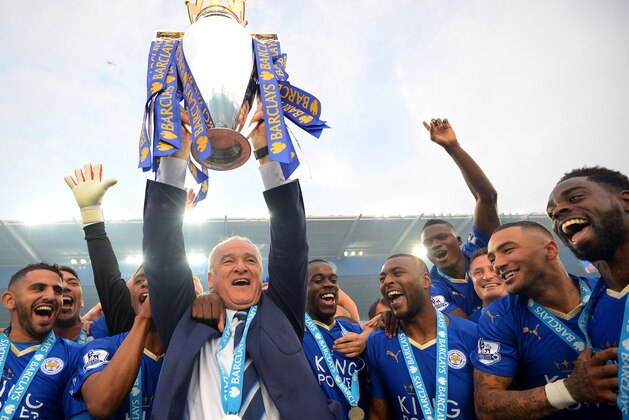 LEICESTER, ENGLAND - MAY 07:  Claudio Ranieri Manager of Leicester City lifts the Premier League Trophy as players celebrate the season champions after the Barclays Premier League match between Leicester City and Everton at The King Power Stadium on May 7, 2016 in Leicester, United Kingdom.  (Photo by Michael Regan/Getty Images)
