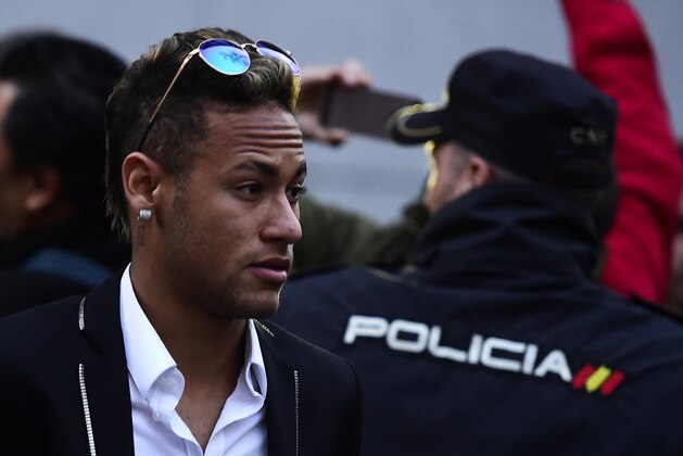 Barcelona's Brazilian forward Neymar leaves Spain's national court in Madrid on February 2, 2016. Barcelona star Neymar and president Josep Maria Bartomeu will be called to give evidence this week in the murky case over the deal which brought the Brazilian to the Catalan giants from Santos in 2013.   AFP PHOTO/ JAVIER SORIANO / AFP / JAVIER SORIANO        (Photo credit should read JAVIER SORIANO/AFP/Getty Images)