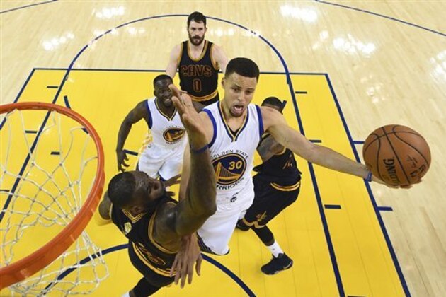 Golden State Warriors guard Stephen Curry (30) shoots against Cleveland Cavaliers forward LeBron James during the first half of Game 2 of basketball's NBA Finals in Oakland, Calif., Sunday, June 5, 2016. (Bob Donnan, USA TODAY Sports Pool via AP, Pool)
