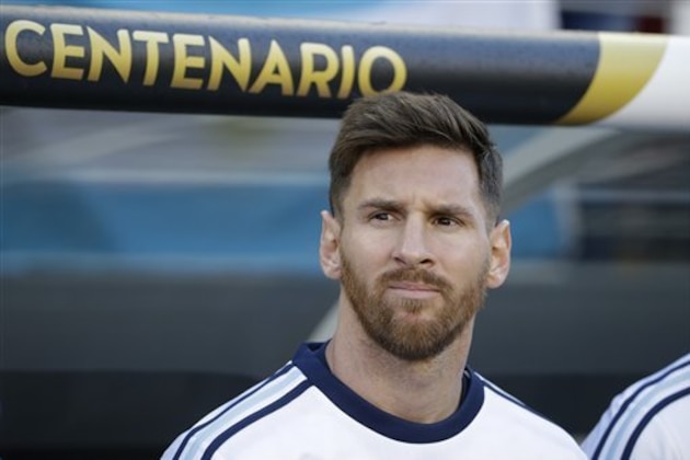 Argentina’s Lionel Messi stands near the bench with teammates before the start of a Copa America Centenario Group A soccer match between Argentina and Chile at the Levi's Stadium in Santa Clara, Calif., Monday, June 6, 2016. (AP Photo/ Marcio Jose Sanchez)