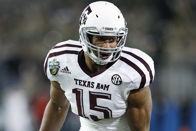 NASHVILLE, TN - DECEMBER 30: Myles Garrett #15 of the Texas A&M Aggies in action against the Louisville Cardinals during the Franklin American Mortgage Music City Bowl at Nissan Stadium on December 30, 2015 in Nashville, Tennessee. Louisville defeated Texas A&M 27-21. (Photo by Joe Robbins/Getty Images)