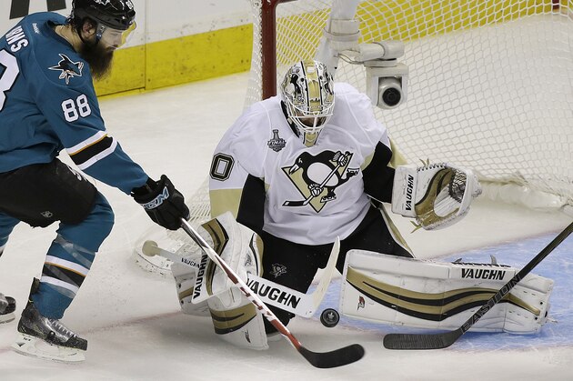 Pittsburgh Penguins goalie Matt Murray, right, defends a shot by San Jose Sharks defenseman Brent Burns (88) during the second period of Game 3 of the NHL hockey Stanley Cup Finals in San Jose, Calif., Saturday, June 4, 2016. (AP Photo/Eric Risberg)