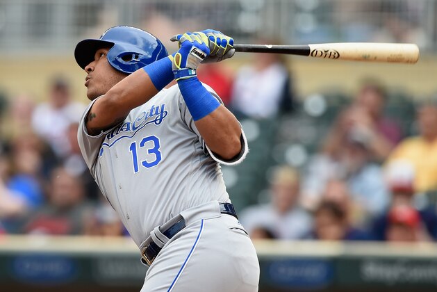 MINNEAPOLIS, MN - MAY 24: Salvador Perez #13 of the Kansas City Royals hits a two-run home run against the Minnesota Twins during the second inning of the game on May 24, 2016 at Target Field in Minneapolis, Minnesota. (Photo by Hannah Foslien/Getty Images)