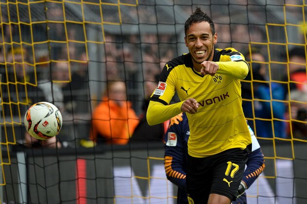 Dortmund's Gabonese striker Pierre-Emerick Aubameyang celebrates scoring the 4-0 goal during the German first division Bundesliga football match Borussia Dortmund vs VfL Wolfsburg, in Dortmund, western Germany, on April 30, 2016. / AFP / Sascha SCHï¿½ï¿½ï¿½ï¿½ï¿½ï¿½RMANN / RESTRICTIONS: DURING MATCH TIME: DFL RULES TO LIMIT THE ONLINE USAGE TO 15 PICTURES PER MATCH AND FORBID IMAGE SEQUENCES TO SIMULATE VIDEO. == RESTRICTED TO EDITORIAL USE == FOR FURTHER QUERIES PLEASE CONTACT DFL DIRECTLY AT + 49 69 650050
        (Photo credit should read SASCHA SCHURMANN/AFP/Getty Images)