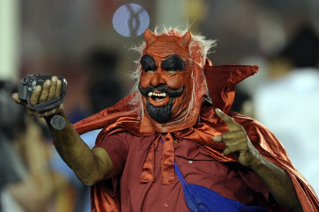 A man supporter of Argentina's Independiente dressed as a devil celebrates after his team winning the Copa Sudamericana  2010 final footbal match after defeating to Brazil's Goias, at Libertadores de America stadium in  Buenos Aires, December 8, 2010.     AFP PHOTO/Alejandro PAGNI (Photo credit should read ALEJANDRO PAGNI/AFP/Getty Images)