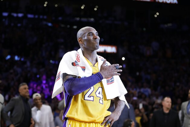 Los Angeles Lakers' Kobe Bryant pounds his chest after the last NBA basketball game of his career against the Utah Jazz, Wednesday, April 13, 2016, in Los Angeles. (AP Photo/Jae C. Hong)