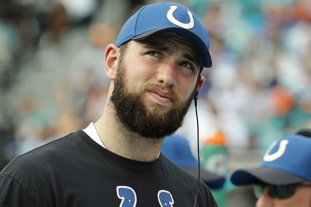 Indianapolis Colts quarterback Andrew Luck looks up from the sidelines during the first half of an NFL football game, Sunday, Dec. 27, 2015, in Miami Gardens, Fla. Luck is not playing due to an injury. (AP Photo/Lynne Sladky)