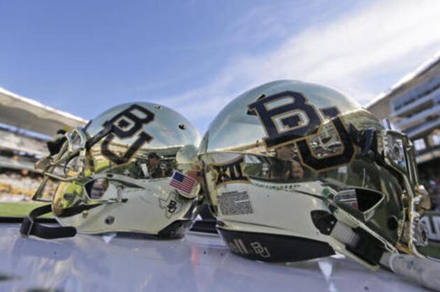 FILE - In this Dec. 5, 2015, file photo, Baylor helmets on shown the field after an NCAA college football game in Waco, Texas. Baylor University will look to rebuild its reputation and perhaps its football program after an outside review found administrators mishandled allegations of sexual assault and the team operated under the perception it was above the rules. (AP Photo/LM Otero, File)
