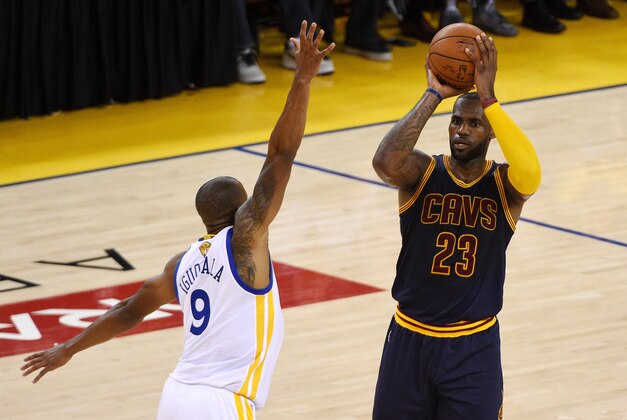 Jun 5, 2016; Oakland, CA, USA; Cleveland Cavaliers forward LeBron James (23) handles the ball against Golden State Warriors forward Andre Iguodala (9) during the second quarter in game two of the NBA Finals at Oracle Arena. Mandatory Credit: Kyle Terada-USA TODAY Sports