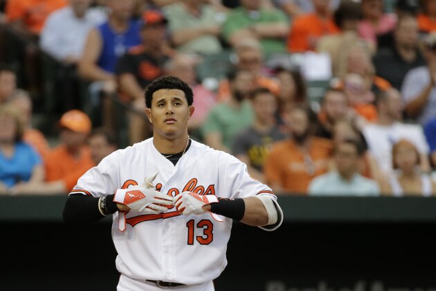 Baltimore Orioles' Manny Machado removes his batting gloves after striking out during a baseball game against the Kansas City Royals in Baltimore, Monday, June 6, 2016. (AP Photo/Patrick Semansky)