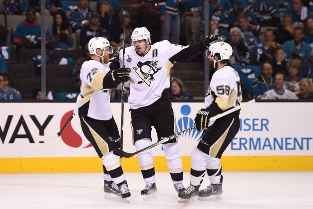 Jun 6, 2016; San Jose, CA, USA; Pittsburgh Penguins center Evgeni Malkin (71) celebrates with right wing Patric Hornqvist (72) and defenseman Kris Letang (58) after scoring a goal against the San Jose Sharks in the second period in game four of the 2016 Stanley Cup Final at SAP Center at San Jose. Mandatory Credit: Kyle Terada-USA TODAY Sports