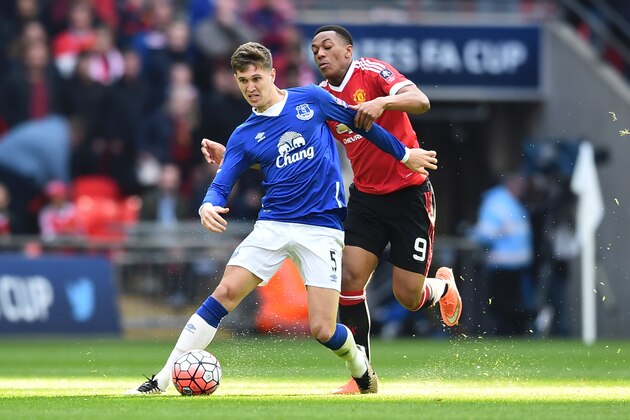 Manchester United's French striker Anthony Martial (R) tries to get in front of Everton's English defender John Stones (L) during the English FA Cup semi-final football match between Everton and Manchester United at Wembley Stadium in London on April 23, 2016. / AFP / BEN STANSALL / NOT FOR MARKETING OR ADVERTISING USE / RESTRICTED TO EDITORIAL USE        (Photo credit should read BEN STANSALL/AFP/Getty Images)
