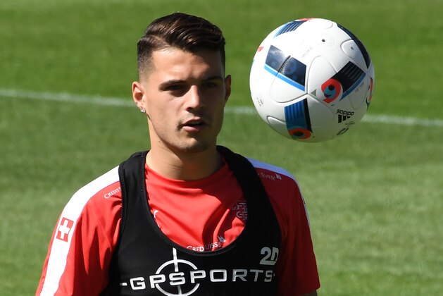 Switzerland's midfielder Granit Xhaka practices during a training session at the team's training ground at the Mosson stadium in Montpellier on June 8, 2016, two days ahead of the beginning of the Euro 2016 European football championships.  / AFP / PASCAL GUYOT        (Photo credit should read PASCAL GUYOT/AFP/Getty Images)