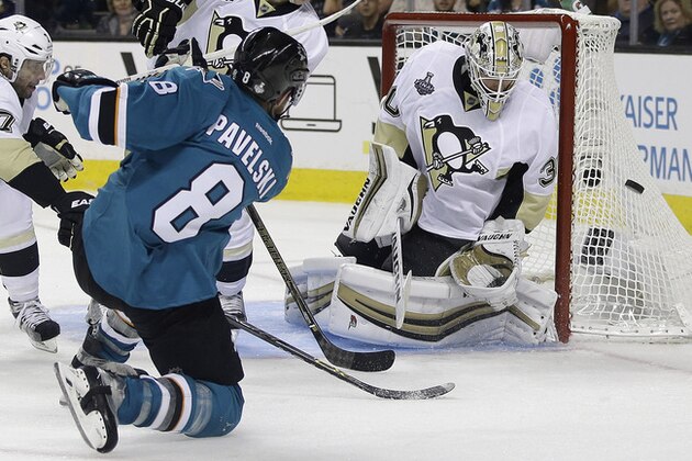 San Jose Sharks center Joe Pavelski (8) misses a shot against Pittsburgh Penguins goalie Matt Murray during overtime of Game 3 of the NHL hockey Stanley Cup Finals in San Jose, Calif., Saturday, June 4, 2016. (AP Photo/Marcio Jose Sanchez)