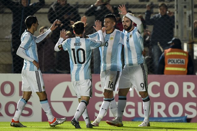 Argentina's forward Gonzalo Higuain (R) celebrates with teammates defender Marcos Rojo (2-R), forward Lionel Messi (C) and  forward Angel Di Maria after scoring against Honduras during a friendly football match at Bicentenario stadium in San Juan, some 1110 Km west of Buenos Aires on May 27, 2016. / AFP / EITAN ABRAMOVICH        (Photo credit should read EITAN ABRAMOVICH/AFP/Getty Images)