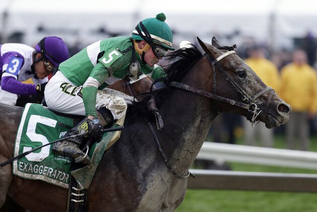 FILE - In this May 21, 2016, file photo, Exaggerator (5), with Kent Desormeaux, aboard moves past Nyquist, ridden by Mario Gutierrez, on the way to winning the 141st Preakness Stakes horse race at Pimlico Race Course in Baltimore. Next Saturday there'll be no Triple try. No Kentucky Derby winner, either. And no sellout crowd. Just Preakness winner Exaggerator taking on 3-year-olds he's already beaten and a few others in their first Triple Crown race.  (AP Photo/Garry Jones, File)