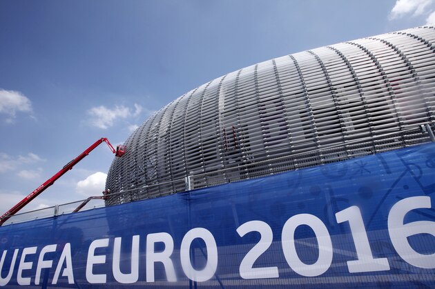 Workers clean the Pierre Mauroy Stadium, just outside Lille, in Villeneuve d'Ascq, Northern France, Wednesday, June 8, 2016. France has revamped its stadiums for the biggest-ever European Championship, which begins Friday when the host nation takes on Romania at the Stade de France in the Paris suburb of Saint-Denis. (AP Photo/Michel Spingler)
