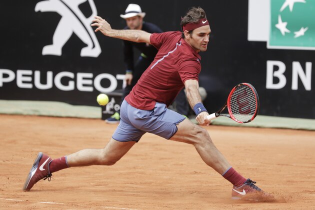 Roger Federer of Switzerland returns the ball to Dominic Thiem of Austria during their match at the Italian Open tennis tournament, in Rome, Thursday, May 12, 2016. (AP Photo/Andrew Medichini)