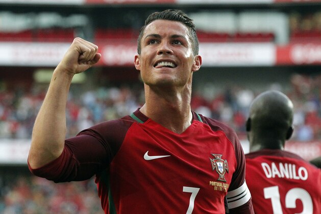 Portugal's Cristiano Ronaldo celebrates after scoring against Estonia during their friendly soccer match at Benfica stadium in Lisbon, Wednesday, June 8 2016. Portugal will play in the Euro2016 in Group stage against Austria, Hungary and Iceland in Group F. (AP Photo/Steven Governo)