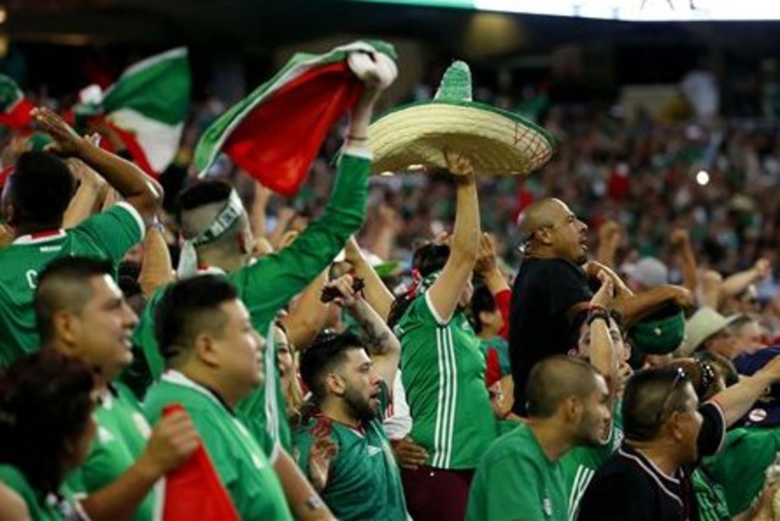 Mexico fans cheer after a goal against Uruguay during the second half of a Copa America group C soccer match at University of Phoenix Stadium, Sunday, June 5, 2016, in Glendale, Ariz. (AP Photo/Matt York)