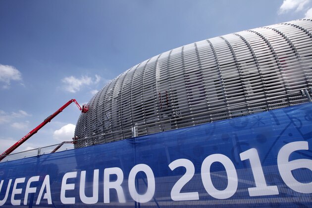 Workers clean the Pierre Mauroy Stadium, just outside Lille, in Villeneuve d'Ascq, Northern France, Wednesday, June 8, 2016. France has revamped its stadiums for the biggest-ever European Championship, which begins Friday when the host nation takes on Romania at the Stade de France in the Paris suburb of Saint-Denis. (AP Photo/Michel Spingler)