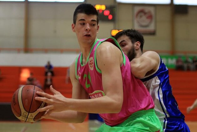 UTRECHT, NETHERLANDS - JULY 17:  Ivica Zubac (L) of Croatia celebrates victory with team mates in the Boys Basketball match between Croatia and Serbia on Day 3 of the European Youth Olympic Festival held at De Uithof Olympos Sports Centre on July 17, 2013 in Utrecht, Netherlands.  (Photo by Dean Mouhtaropoulos/Getty Images)