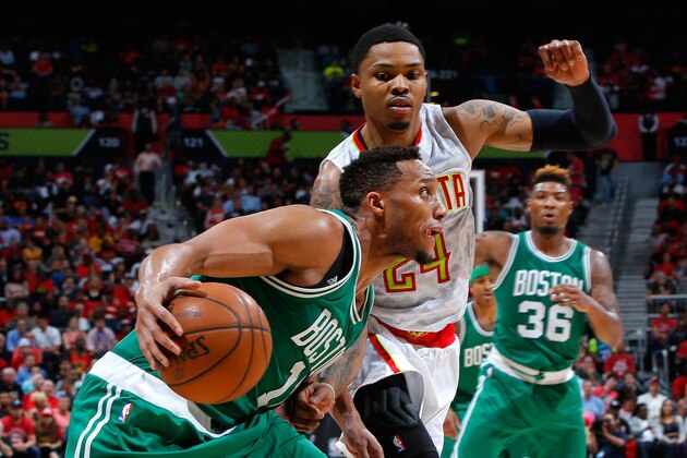 ATLANTA, GA - APRIL 19:  Evan Turner #11 of the Boston Celtics drives againts Kent Bazemore #24 of the Atlanta Hawks in Game Two of the Eastern Conference Quarterfinals during the 2016 NBA Playoffs at Philips Arena on April 19, 2016 in Atlanta, Georgia.  NOTE TO USER User expressly acknowledges and agrees that, by downloading and or using this photograph, user is consenting to the terms and conditions of the Getty Images License Agreement.  (Photo by Kevin C. Cox/Getty Images)