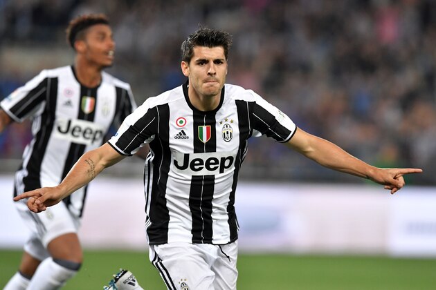 Juventus' forward from Spain Alvaro Morata celerates after scoring during the Italian Tim Cup final football match AC Milan vs Juventus on May 21, 2016 at the Olympic Stadium in Rome.     AFP PHOTO / TIZIANA FABI / AFP / TIZIANA FABI        (Photo credit should read TIZIANA FABI/AFP/Getty Images)