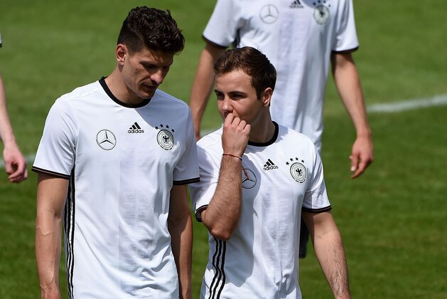 Germany's striker Mario Gomez and Germany's striker Mario Goetze react during a training session as part of the team's preparation for the upcoming Euro 2016 European football championships, on May 26, 2016 in Ascona. / AFP / PATRIK STOLLARZ        (Photo credit should read PATRIK STOLLARZ/AFP/Getty Images)