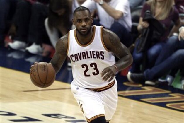 Cleveland Cavaliers forward LeBron James brings the ball up court against the Golden State Warriors during the first half of Game 3 of basketball's NBA Finals in Cleveland, Wednesday, June 8, 2016. (AP Photo/Ron Schwane)