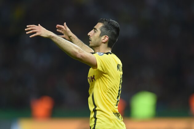 Dortmund's Armenian midfielder Henrikh Mkhitaryan reacts during the German Cup (DFB Pokal) final football match Bayern Munich vs Borussia Dortmund at the Olympic stadium in Berlin on May 21, 2016. / AFP / Christof STACHE / RESTRICTIONS: ACCORDING TO DFB RULES IMAGE SEQUENCES TO SIMULATE VIDEO IS NOT ALLOWED DURING MATCH TIME. MOBILE (MMS) USE IS NOT ALLOWED DURING AND FOR FURTHER TWO HOURS AFTER THE MATCH. == RESTRICTED TO EDITORIAL USE == FOR MORE INFORMATION CONTACT DFB DIRECTLY AT +49 69 67880

 /         (Photo credit should read CHRISTOF STACHE/AFP/Getty Images)