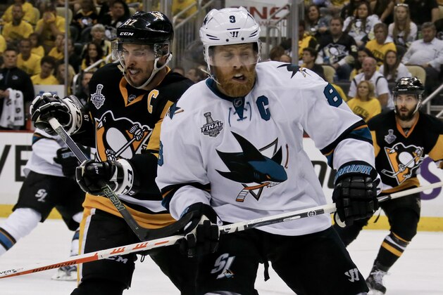 San Jose Sharks' Joe Pavelski (8), right,  plays against Pittsburgh Penguins' Sidney Crosby (87) during the second period in Game 2 of the NHL hockey Stanley Cup Finals on Wednesday, June 1, 2016, in Pittsburgh. (AP Photo/Keith Srakocic)