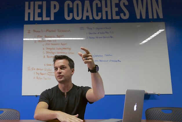 John Wirtz, Chief Product Officer of hudl, speaks in the company's conference room in Lincoln, Neb., Thursday, Aug. 14, 2014. Hudl is a software company that has developed a way to immediately get game film to coaches and break down and separate different plays by type. (AP Photo/Nati Harnik)