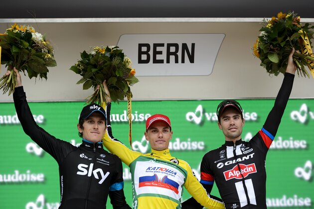 (L-R) Second-placed Britain's Geraint Thomas of Sky team, winner Slovenia's Simon Spilak of Katusha team and third-placed Netherland's Tom Dumoulin of Giant team pose on the podium of the race during the podium ceremony after the final stage of the Tour de Suisse UCI World Tour, a 38,4 km individual time-trial race in the streets of the Swiss capital Bern, on June 21, 2015. Spilak produced a stunning final stage timetrial to snatch victory in the Tour of Switzerland on June 21.  AFP PHOTO / FABRICE COFFRINI        (Photo credit should read FABRICE COFFRINI/AFP/Getty Images)