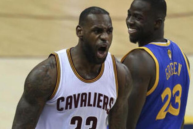 Cleveland Cavaliers forward LeBron James, left, reacts as Golden State Warriors forward Draymond Green, right, looks back during the first half of Game 3 of basketball's NBA Finals in Cleveland, Wednesday, June 8, 2016. (AP Photo/Ron Schwane)