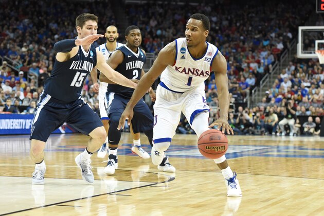 LOUISVILLE, KY - MARCH 26:  Wayne Selden Jr. #1 of the Kansas Jayhawks dribbles the ball during the quarterfinal of the 2016 NCAA Men's Basketball Tournament game against the Villanova Wildcats at the KFC Yum! Center on March 26, 2016 in the Louisville, Kentucky.  The Wildcats won 64-59.  (Photo by Mitchell Layton/Getty Images)