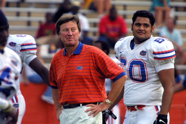 Florida head Coach Steve Spurrier smiles prior to the team's first scrimmage Wednesday, Aug. 15, 2001, in Gainesville, Fla.  At right is defensive tackle Bryan Savelio. (AP Photo/Glenn Danforth)
