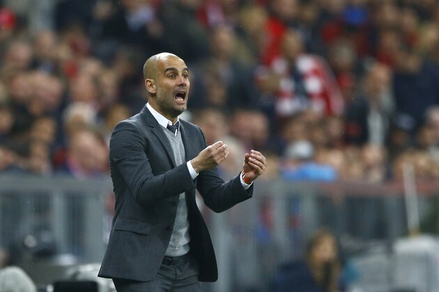 Bayern's head coach Pep Guardiola gives instruction to his players during the Champions League second leg semifinal soccer match between Bayern Munich and Atletico de Madrid in Munich, Germany, Tuesday, May 3, 2016. (AP Photo/Matthias Schrader)