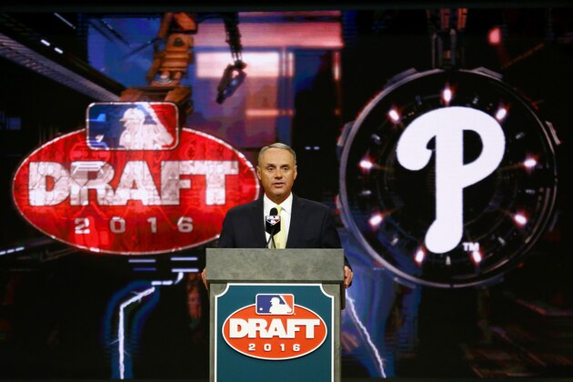 Baseball Commissioner Rob Manfred announces the No. 1 pick by the Philadelphia Phillies during the draft, Thursday, June 9, 2016, in Secaucus, N.J. The Phillies selected outfielder Mickey Moniak, of La Costa Canyon High School in Carlsbad, Calif., with the first pick. (AP Photo/Julio Cortez)