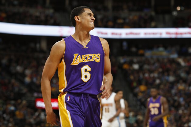 Los Angeles Lakers guard Jordan Clarkson (6) reacts after straining his hip in the second half of an NBA basketball game Wednesday, March 2, 2016, in Denver. The Nuggets won 117-107. (AP Photo/David Zalubowski)