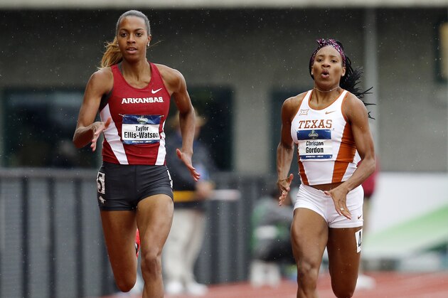 Arkansas' Taylor Ellis-Watson, left, and Texas' Chrisann Gordon, right, compete in a women's 400-meter semifinal at the NCAA outdoor track and field championships in Eugene, Ore., Thursday, June 9, 2016. (AP Photo/Ryan Kang)