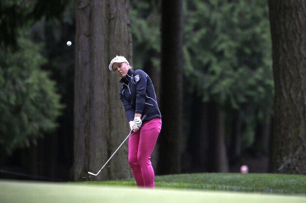 Brooke Henderson, of Canada, chips the ball during the first round of the Women's PGA Championship golf tournament at Sahalee Country Club Thursday, June 9, 2016, in Sammamish, Wash. (AP Photo/Elaine Thompson)