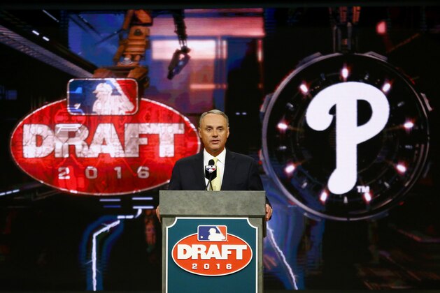 Baseball Commissioner Rob Manfred announces the No. 1 pick by the Philadelphia Phillies during the draft, Thursday, June 9, 2016, in Secaucus, N.J. The Phillies selected outfielder Mickey Moniak, of La Costa Canyon High School in Carlsbad, Calif., with the first pick. (AP Photo/Julio Cortez)