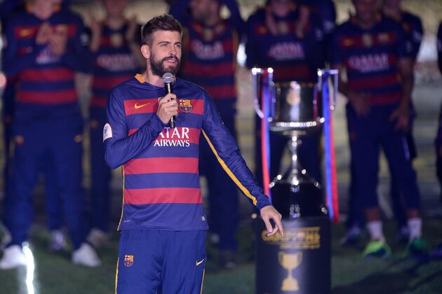 Barcelona's defender Gerard Pique speaks during celebrations at the Camp Nou stadium in Barcelona on May 23, 2016 following their Spanish 'Copa del Rey' (King's Cup) final football match 2-0 victory over Sevilla FC yesterday also marking the club's 28th Copa del Rey win and the 24th Spanish Liga title. / AFP / JOSEP LAGO        (Photo credit should read JOSEP LAGO/AFP/Getty Images)